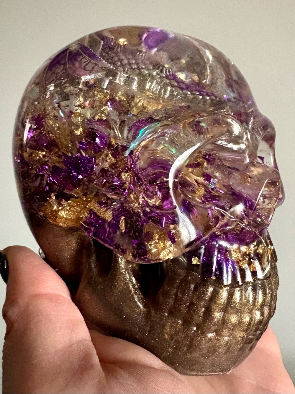 Resin Skull Sculpture with Purple and Gold Accents and Embedded Dragon